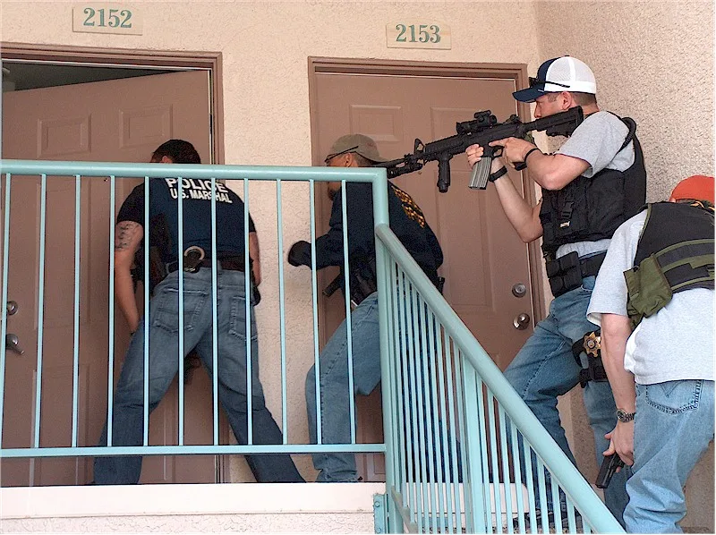 Deputy US Marshals conducting high-risk tactical entry and knock-and-announce warrant operation